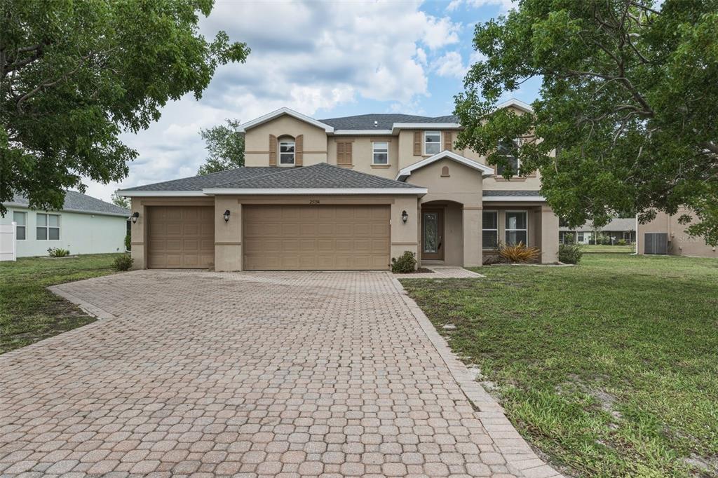 25134 Palisade Road Punta Gorda, FL 33983 - Photo 4 of 58 front view of a house with a yard