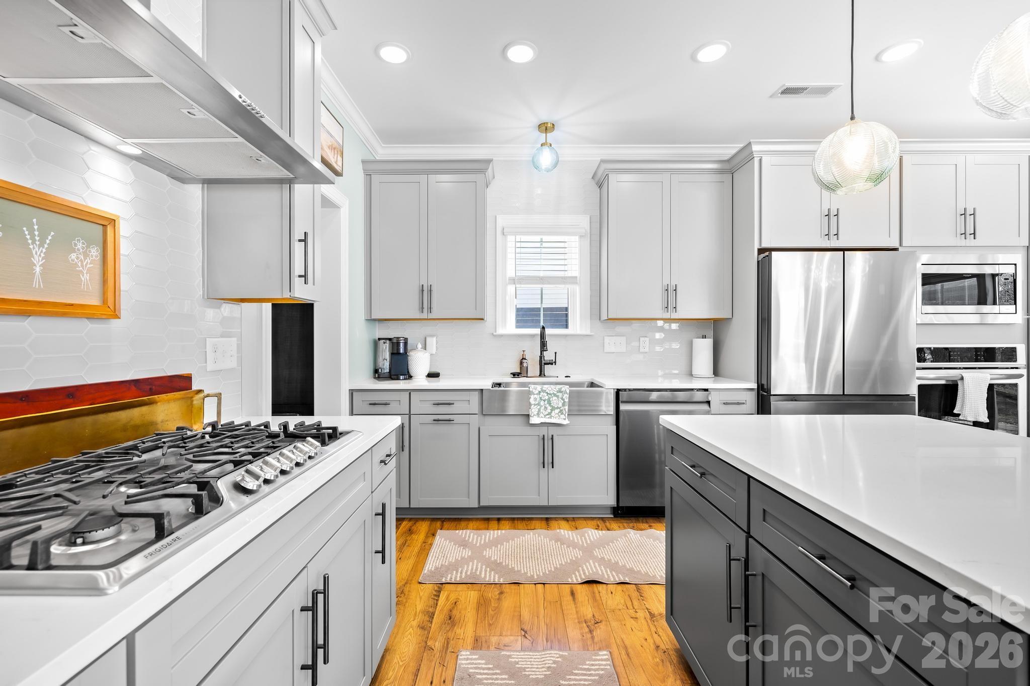 2509 St James Church Road Denver, NC 28037 - Photo 13 of 41 a kitchen with a stove a sink and a refrigerator