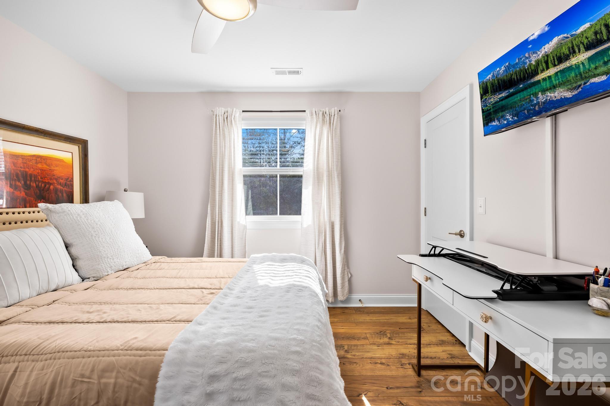 2509 St James Church Road Denver, NC 28037 - Photo 21 of 41 a bedroom with a bed and a window
