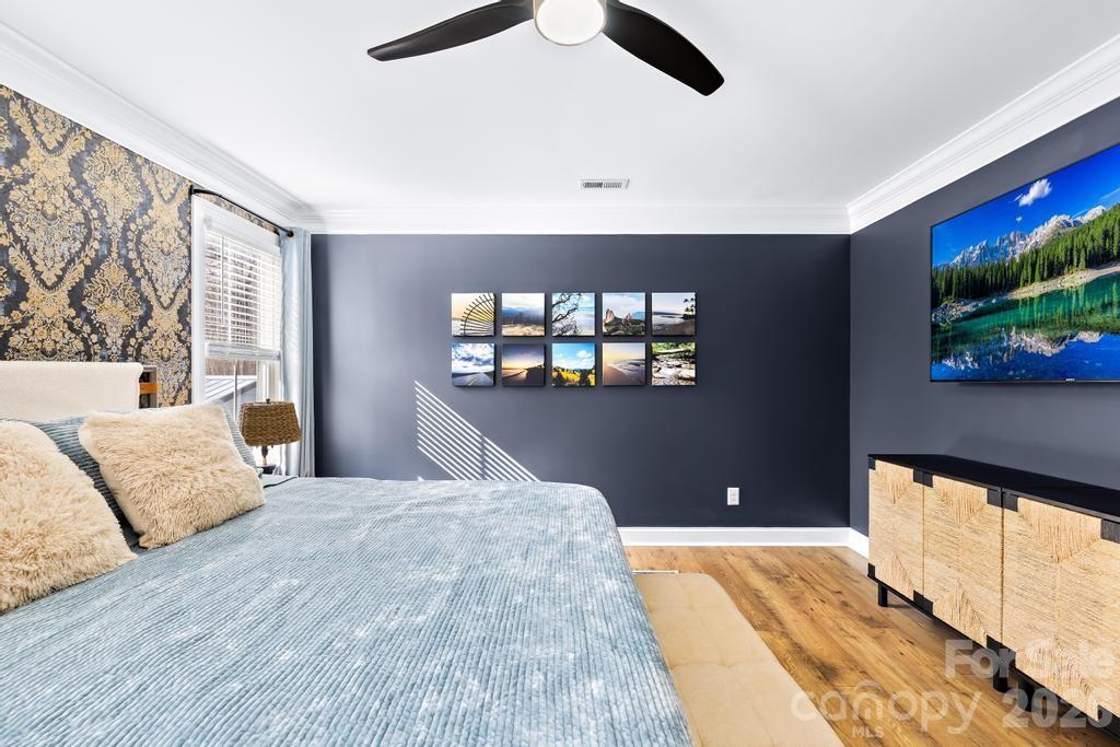 2509 St James Church Road Denver, NC 28037 - Photo 29 of 41 a bedroom with a large bed and a large window
