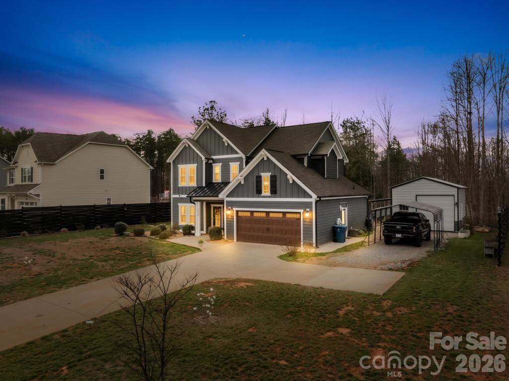 2509 St James Church Road Denver, NC 28037 - Photo 3 of 41 a view of a big house with wooden fence