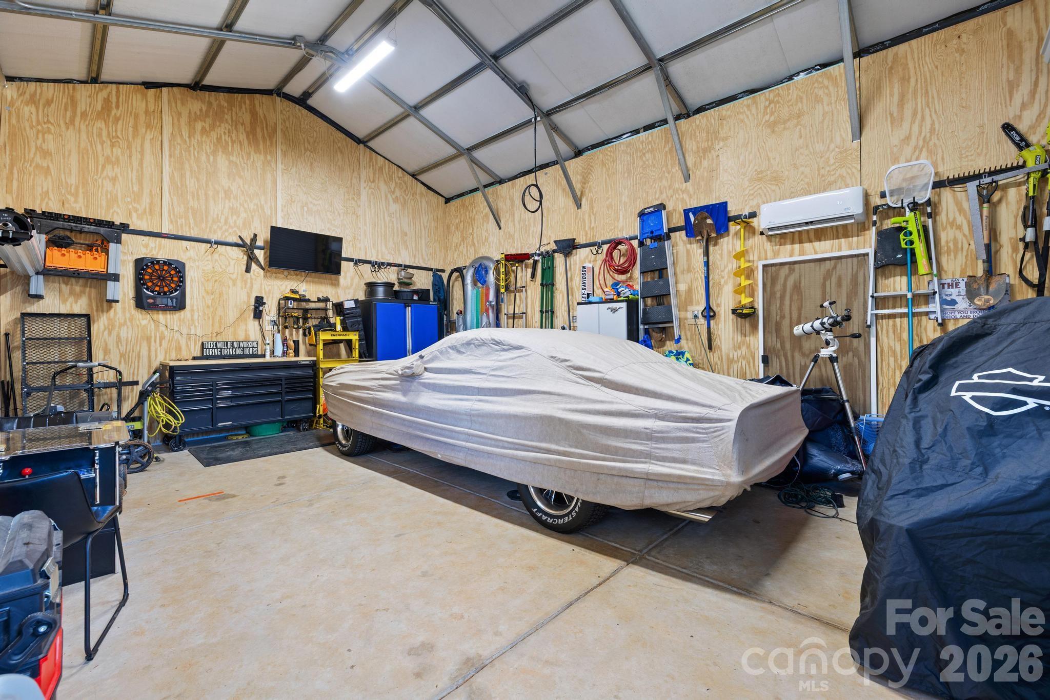 2509 St James Church Road Denver, NC 28037 - Photo 34 of 41 a bed room with a bed and a book shelf