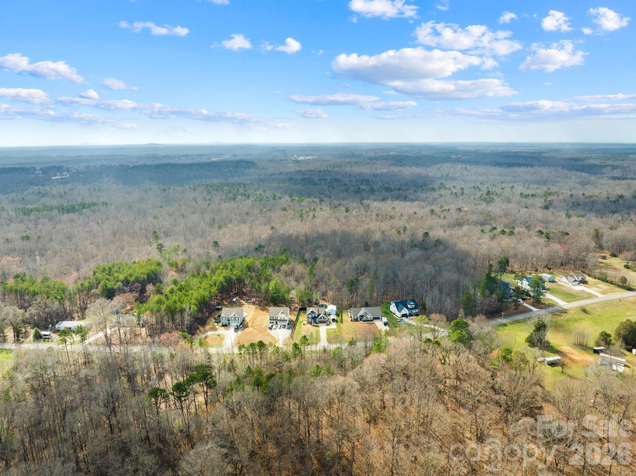 2509 St James Church Road Denver, NC 28037 - Photo 38 of 41 a view of a lake with a yard