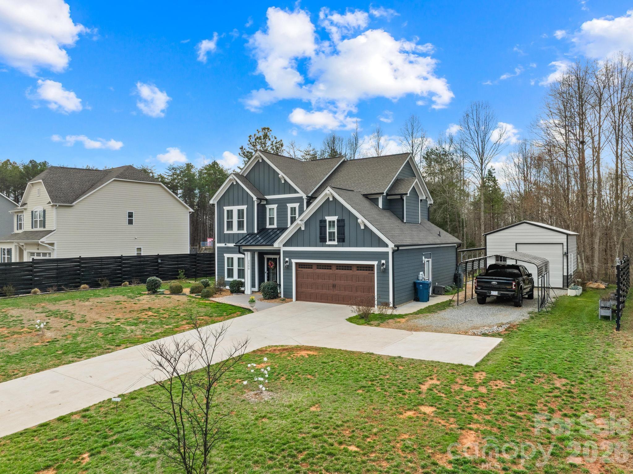 2509 St James Church Road Denver, NC 28037 - Photo 40 of 41 a view of a house with a big yard and large trees