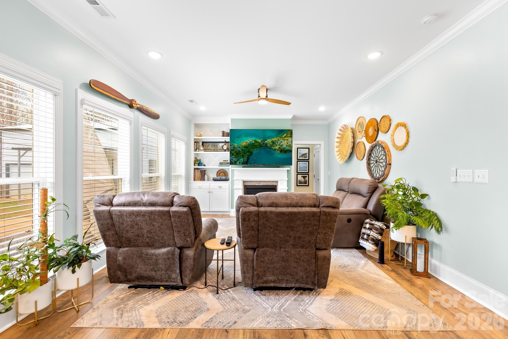 2509 St James Church Road Denver, NC 28037 - Photo 8 of 41 a living room with furniture and a potted plant