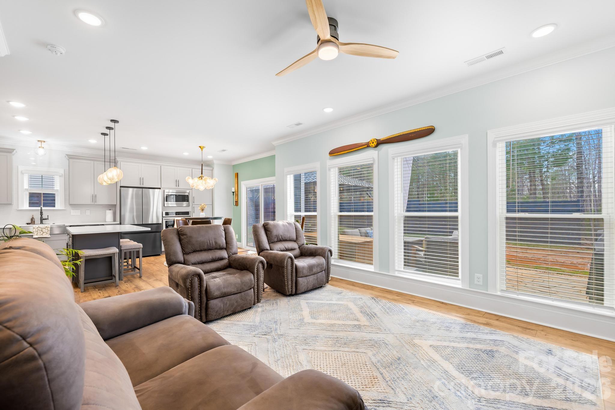 2509 St James Church Road Denver, NC 28037 - Photo 9 of 41 a living room with furniture and a large window