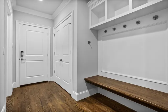 a view of a room with wooden floor