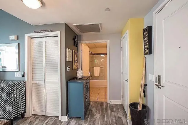 a view of hallway with wooden floor