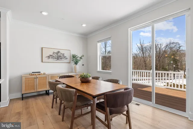 a large kitchen with stainless steel appliances kitchen island a large counter top and a sink