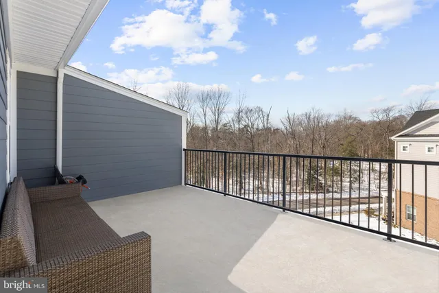 a view of balcony with wooden fence