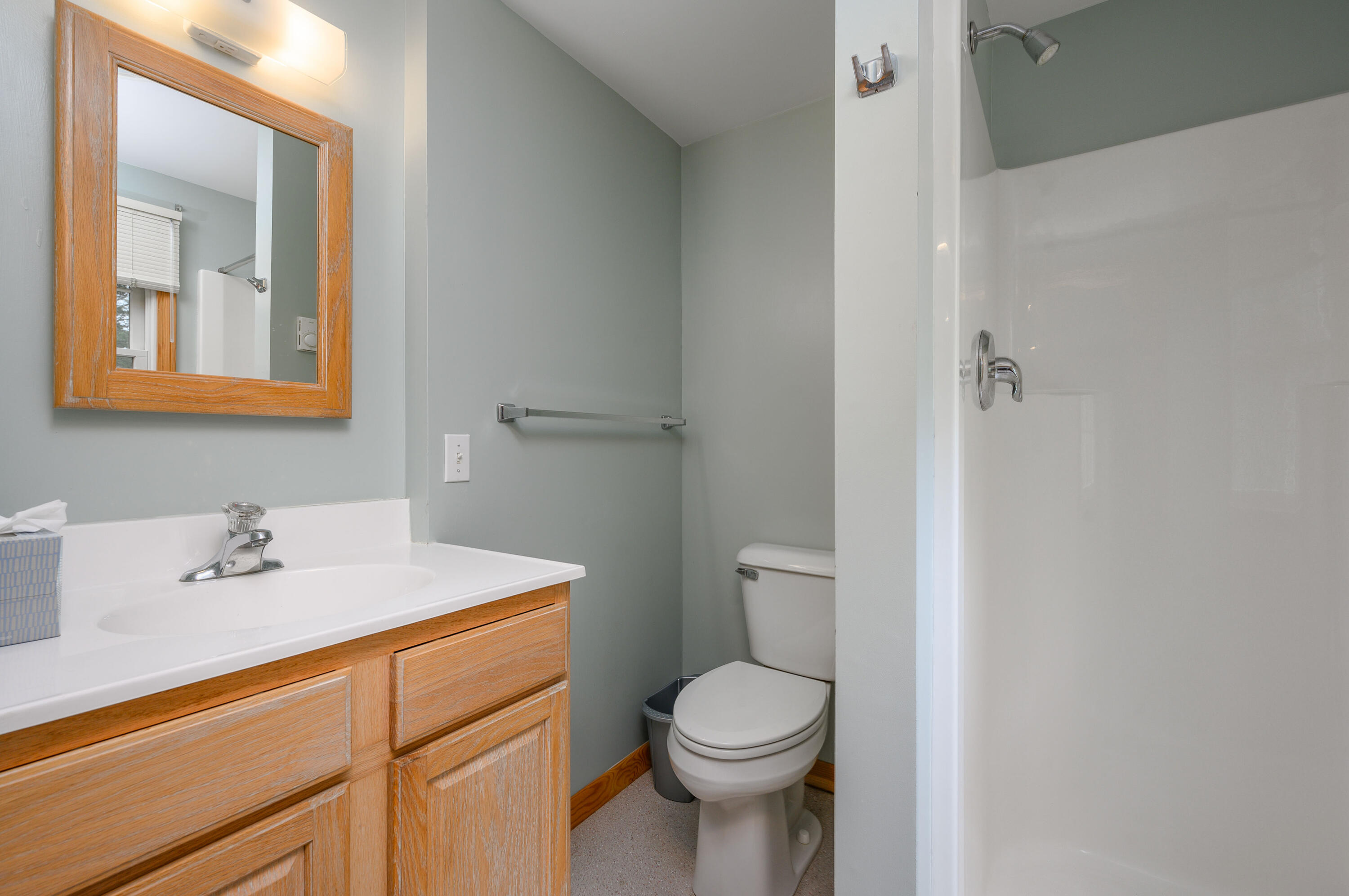 1500 Bridge Road Eastham, MA 02642 - Photo 13 of 41 a bathroom with a sink mirror vanity and toilet