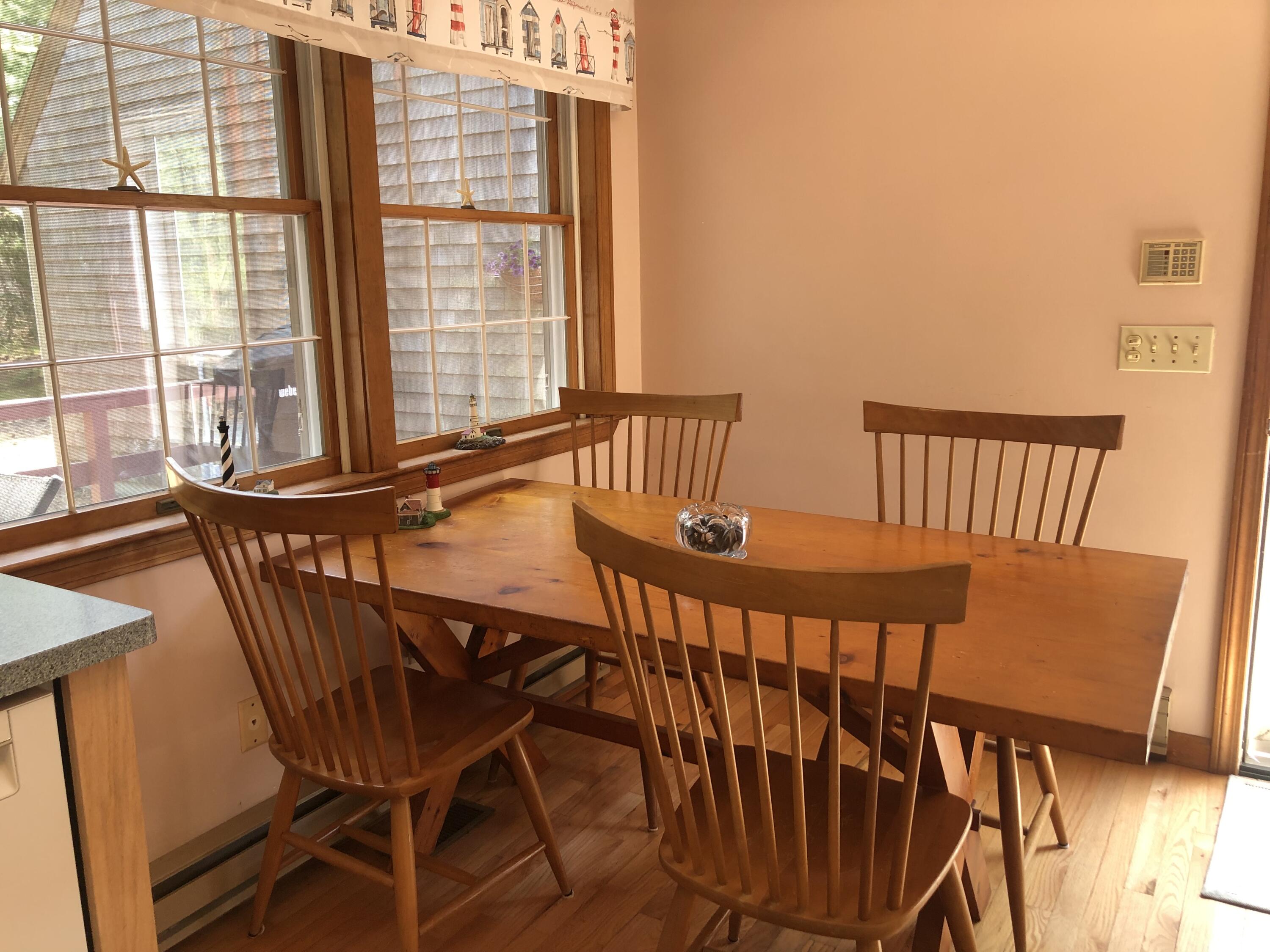 1500 Bridge Road Eastham, MA 02642 - Photo 21 of 41 a view of a chairs and table in the balcony