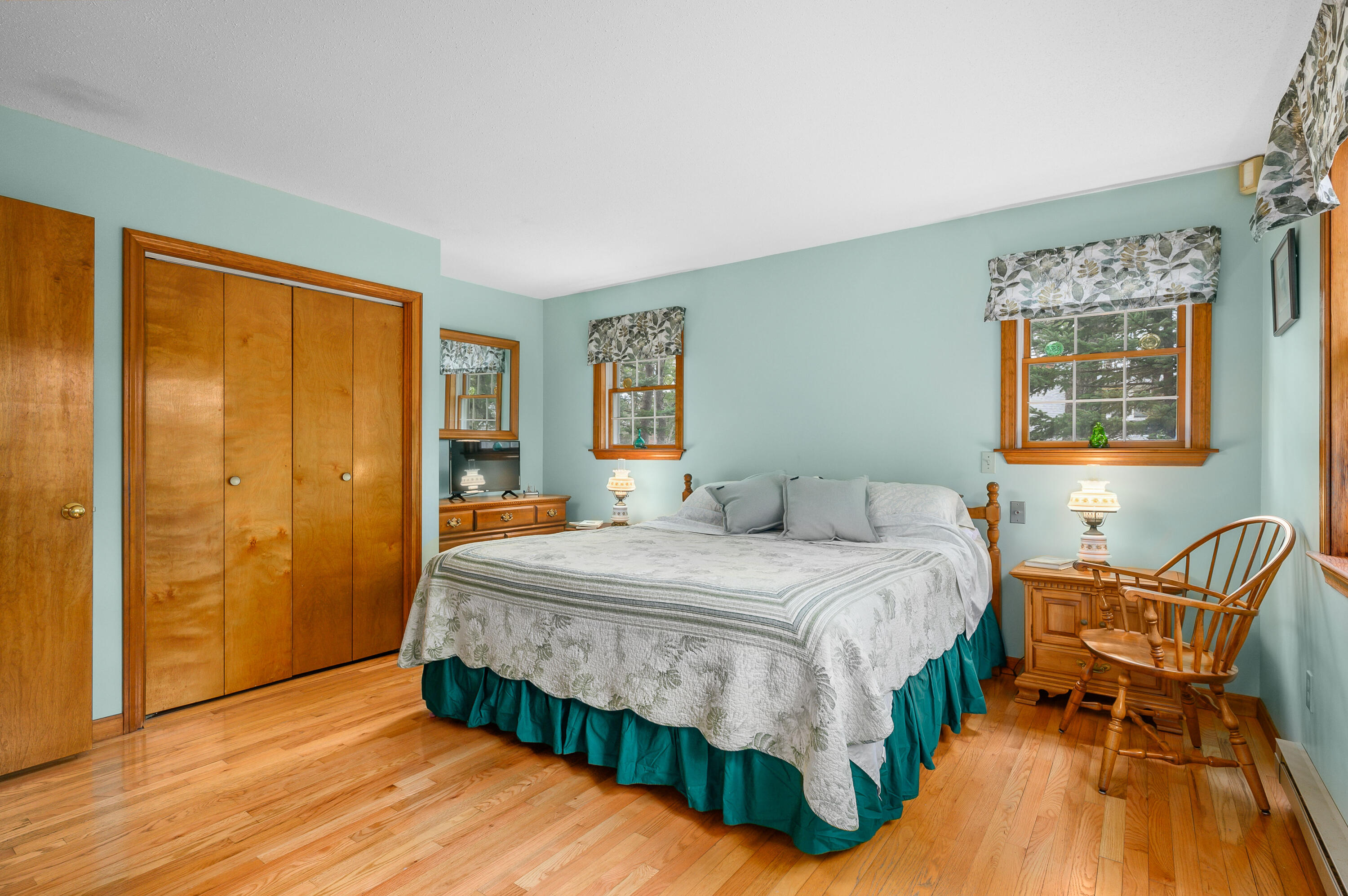 1500 Bridge Road Eastham, MA 02642 - Photo 25 of 41 a bedroom with a bed and wooden floor