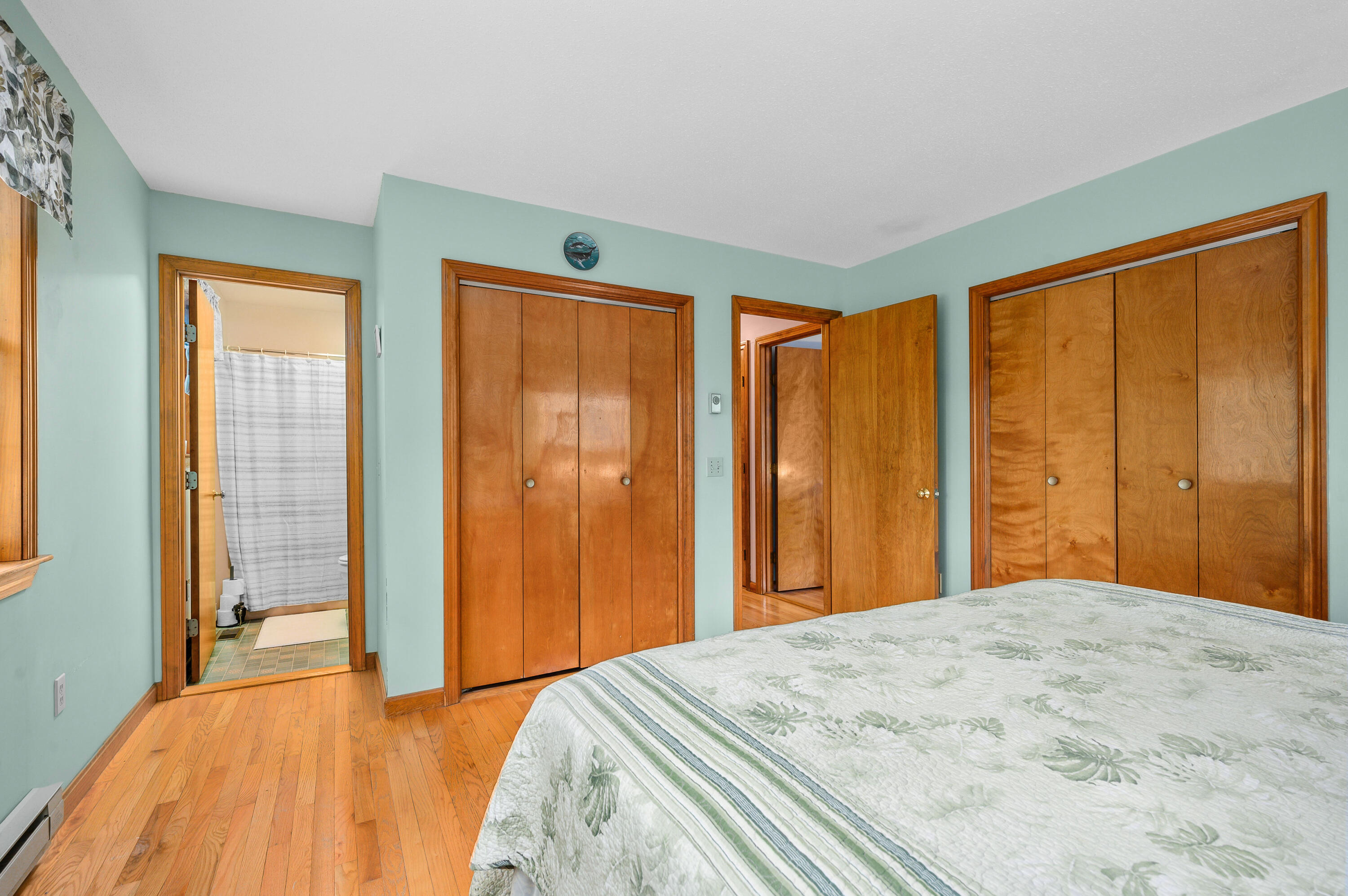 1500 Bridge Road Eastham, MA 02642 - Photo 26 of 41 a bedroom with a large bed and a large window
