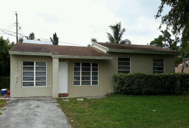6441 Southwest 16th Street Pompano Beach, FL 33068 - Photo 1 of 1 a front view of a house with garden