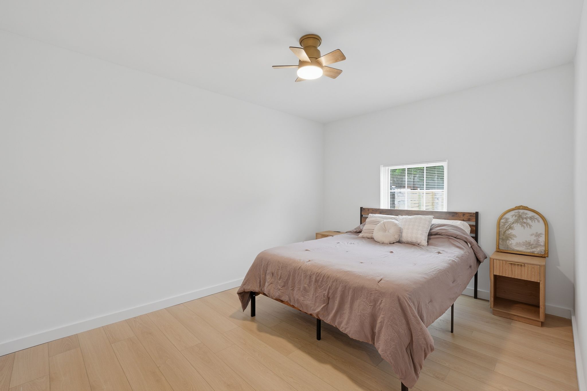 6804 Meadow Run Austin, TX 78745 - Photo 18 of 34 This room features light-toned hardwood flooring and a window providing natural light