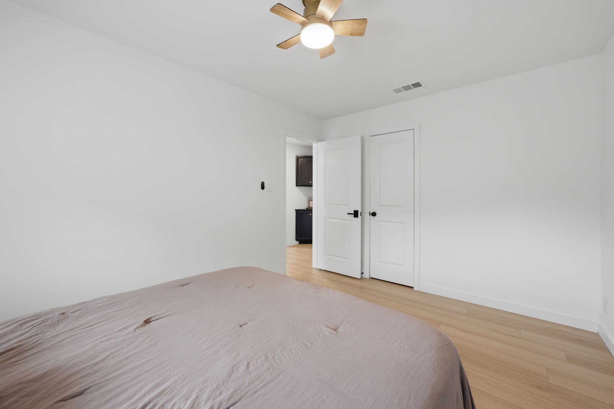 6804 Meadow Run Austin, TX 78745 - Photo 20 of 34 This room features light-colored flooring, a ceiling fan with integrated lighting, and white walls
