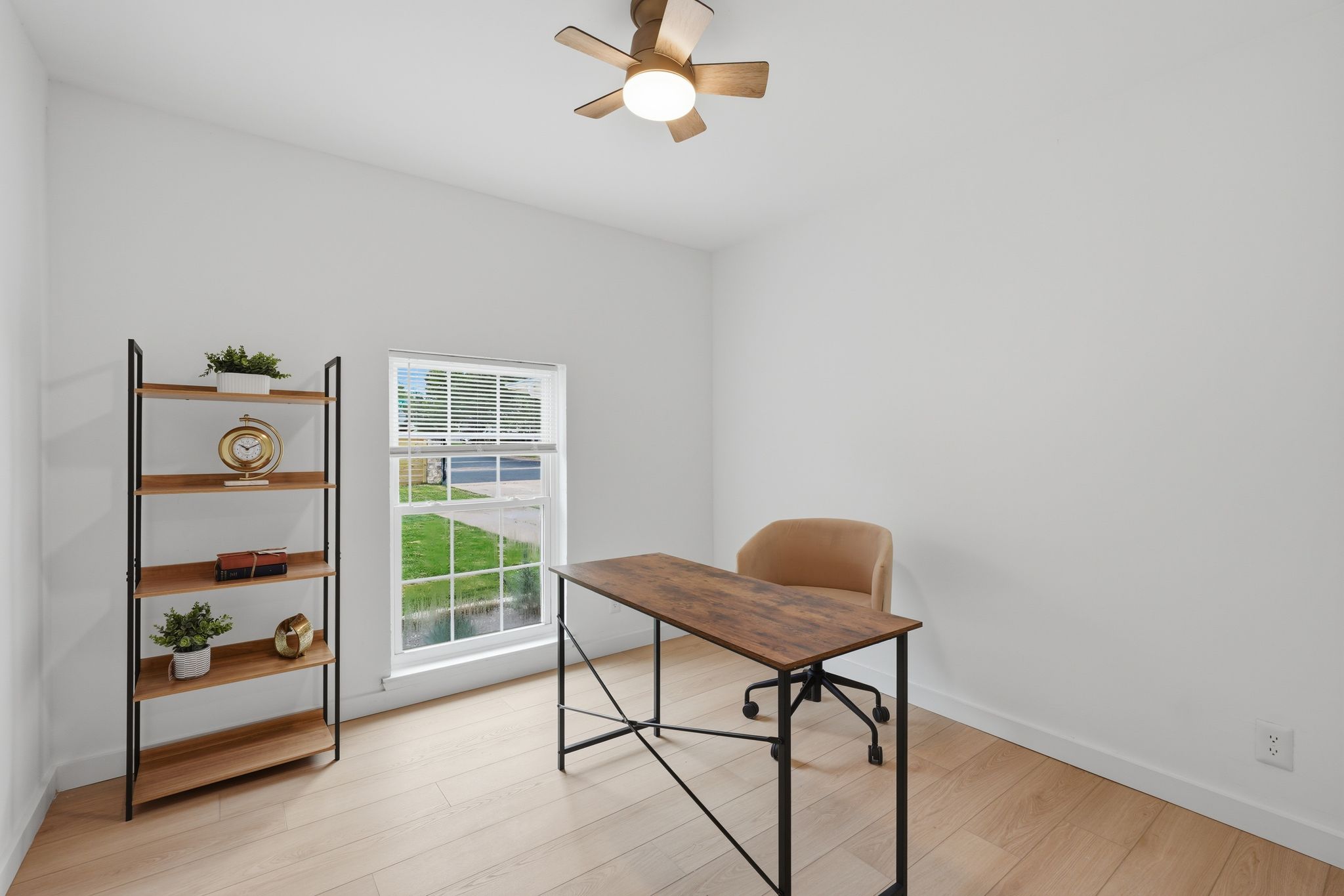 6804 Meadow Run Austin, TX 78745 - Photo 21 of 34 The room features light-colored flooring, a window providing natural light, and a ceiling fan