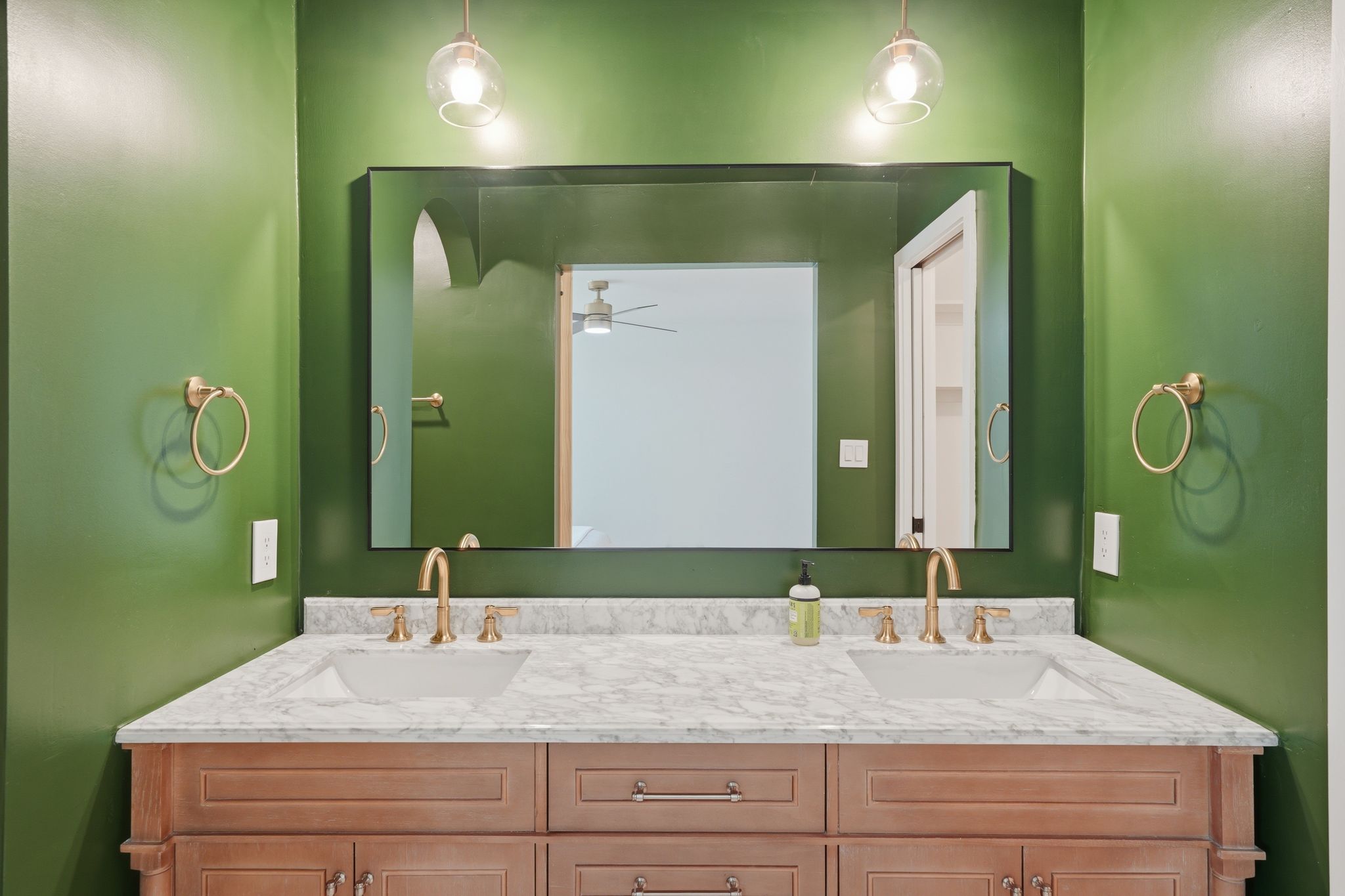 6804 Meadow Run Austin, TX 78745 - Photo 24 of 34 The bathroom features a dual vanity with a light-colored countertop and two rectangular sinks