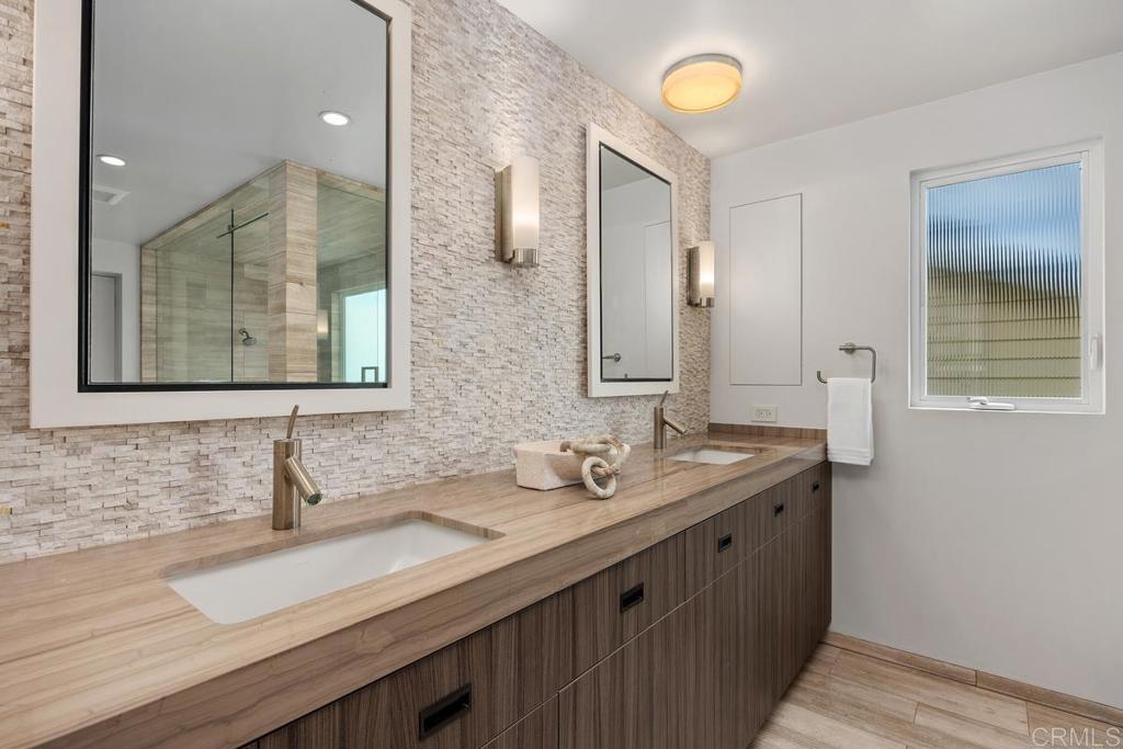 1856 Parliament Road Encinitas, CA 92024 - Photo 25 of 42 a bathroom with a sink and a mirror