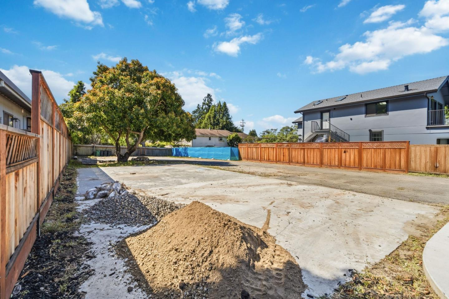 4920-4924 Bridge Street Soquel, CA 95073 - Photo 13 of 24 a view of a backyard with wooden fence