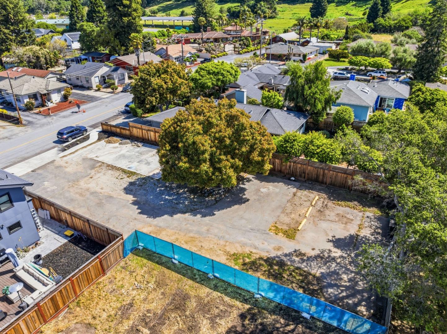 4920-4924 Bridge Street Soquel, CA 95073 - Photo 7 of 24 an aerial view of a house with a yard and lake view