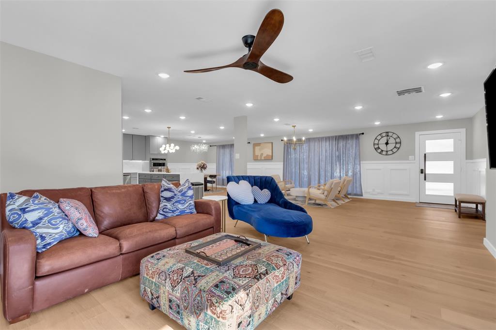11107 Hillcrest Road Dallas, TX 75230 - Photo 11 of 29 a living room with furniture and kitchen view