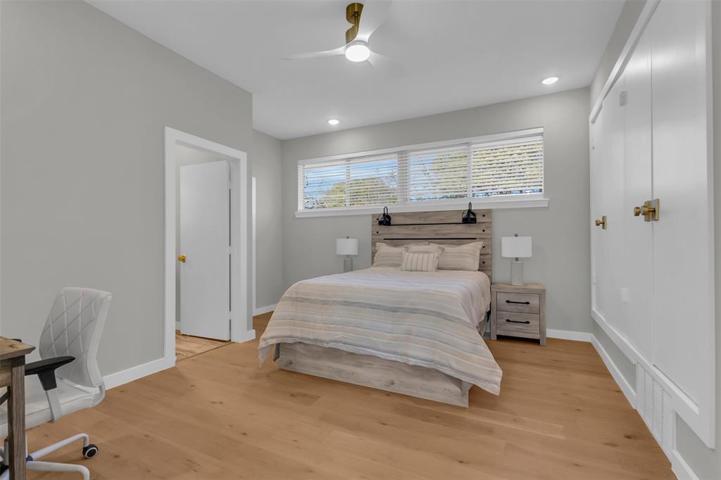 11107 Hillcrest Road Dallas, TX 75230 - Photo 12 of 29 a bedroom with a bed and window