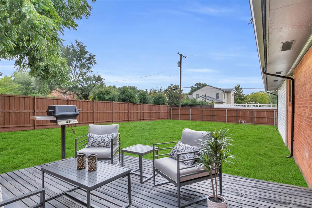 11107 Hillcrest Road Dallas, TX 75230 - Photo 29 of 29 a view of a chairs and backyard with a slide