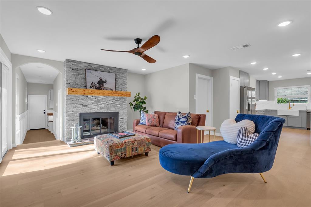 11107 Hillcrest Road Dallas, TX 75230 - Photo 10 of 29 a living room with furniture and a fireplace