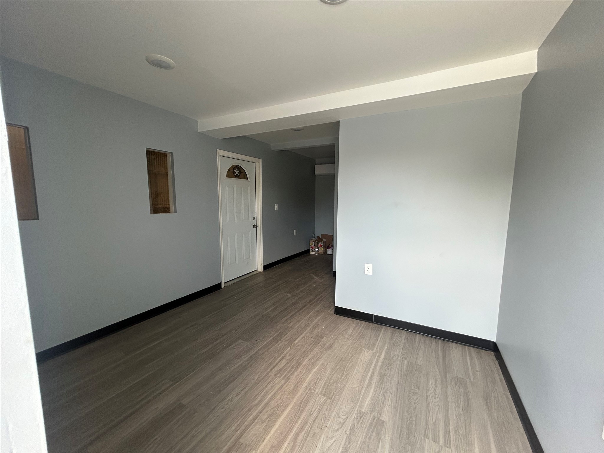 6936 Lozier Street Houston, TX 77021 - Photo 6 of 6 an empty room with wooden floor and closet