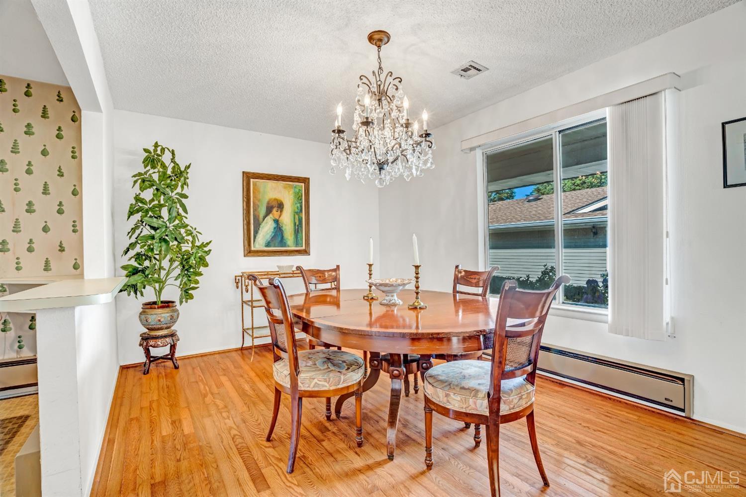 786 Pompton Road, Unit B Monroe Township, NJ 08831 - Photo 12 of 28 a view of a dining room with furniture window and wooden floor