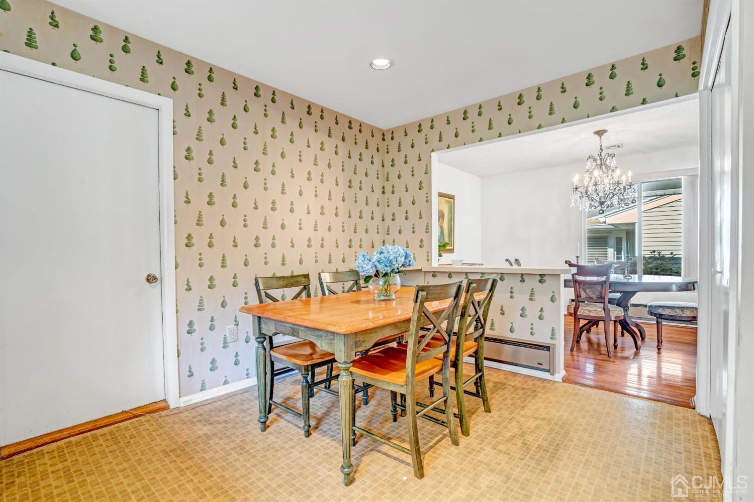 786 Pompton Road, Unit B Monroe Township, NJ 08831 - Photo 16 of 28 a view of a dining room with furniture and chandelier
