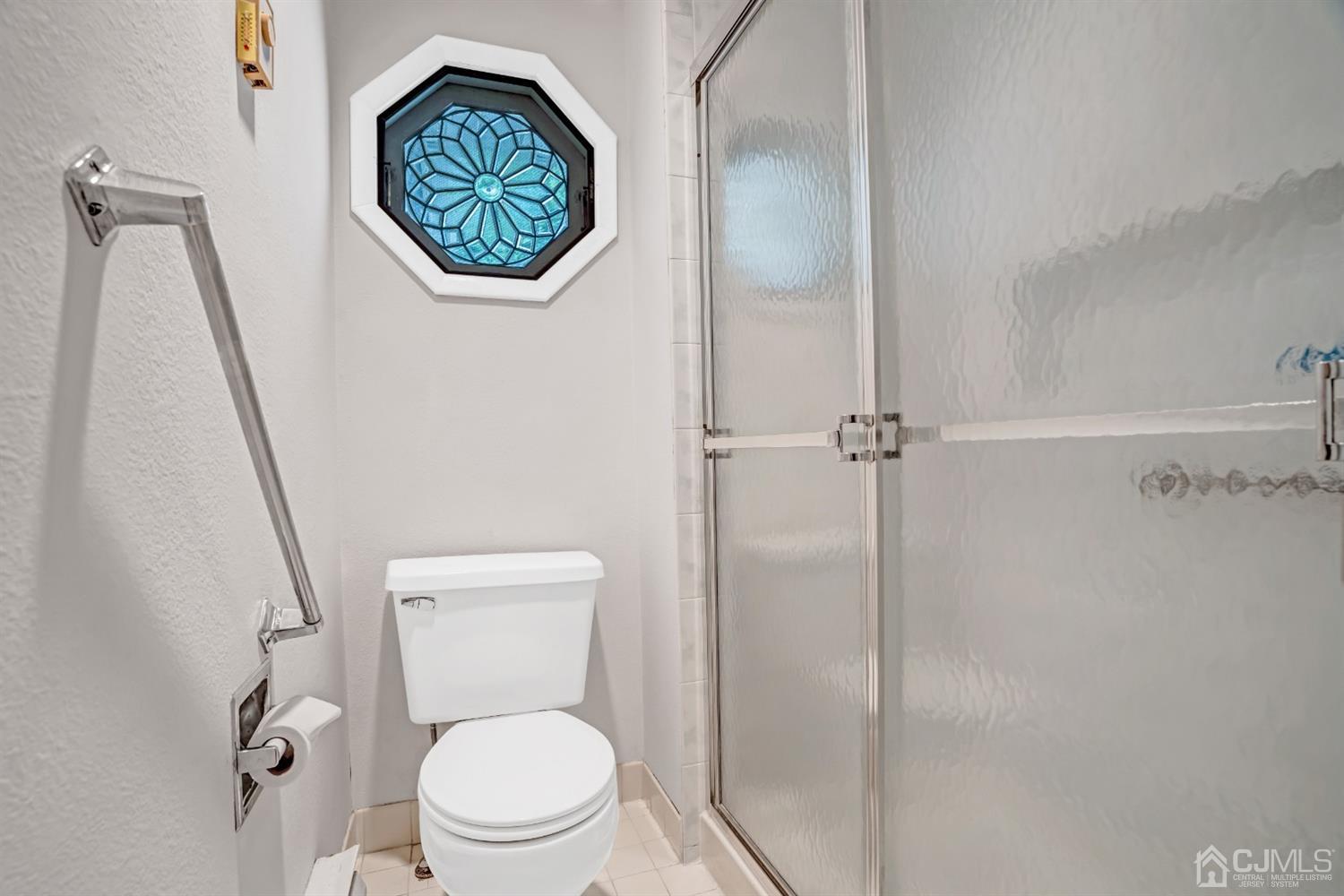 786 Pompton Road, Unit B Monroe Township, NJ 08831 - Photo 21 of 28 a white toilet sitting next to a shower