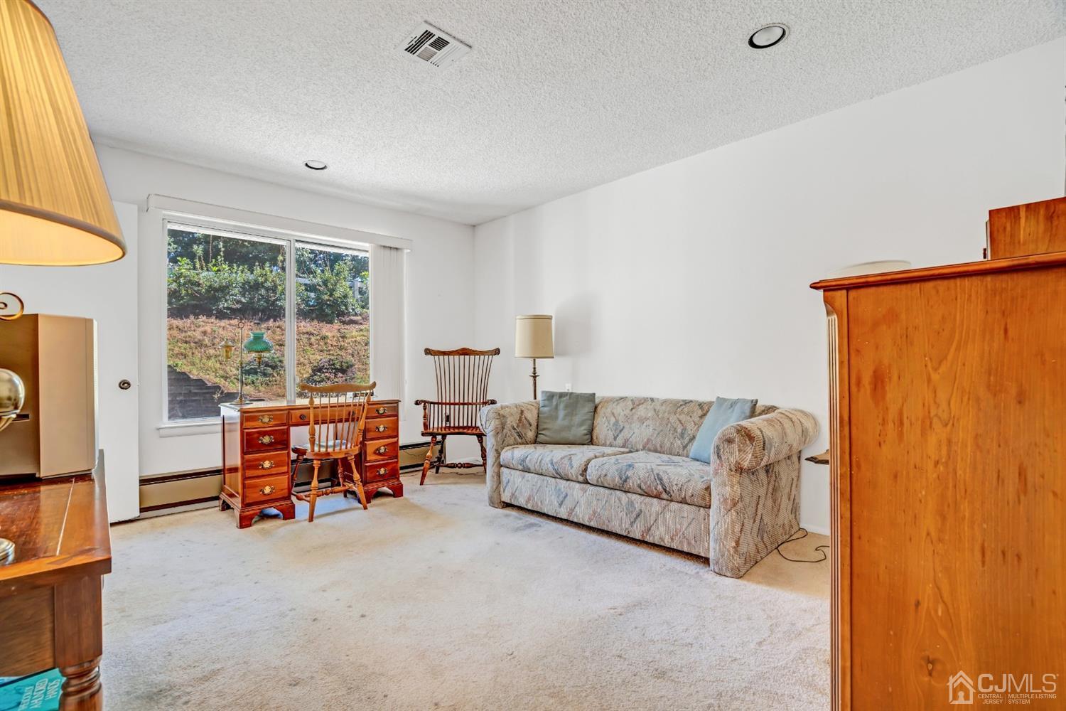 786 Pompton Road, Unit B Monroe Township, NJ 08831 - Photo 22 of 28 a living room with furniture and large windows