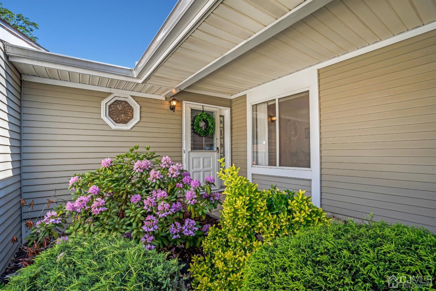 786 Pompton Road, Unit B Monroe Township, NJ 08831 - Photo 4 of 28 a view of a house with a flower garden