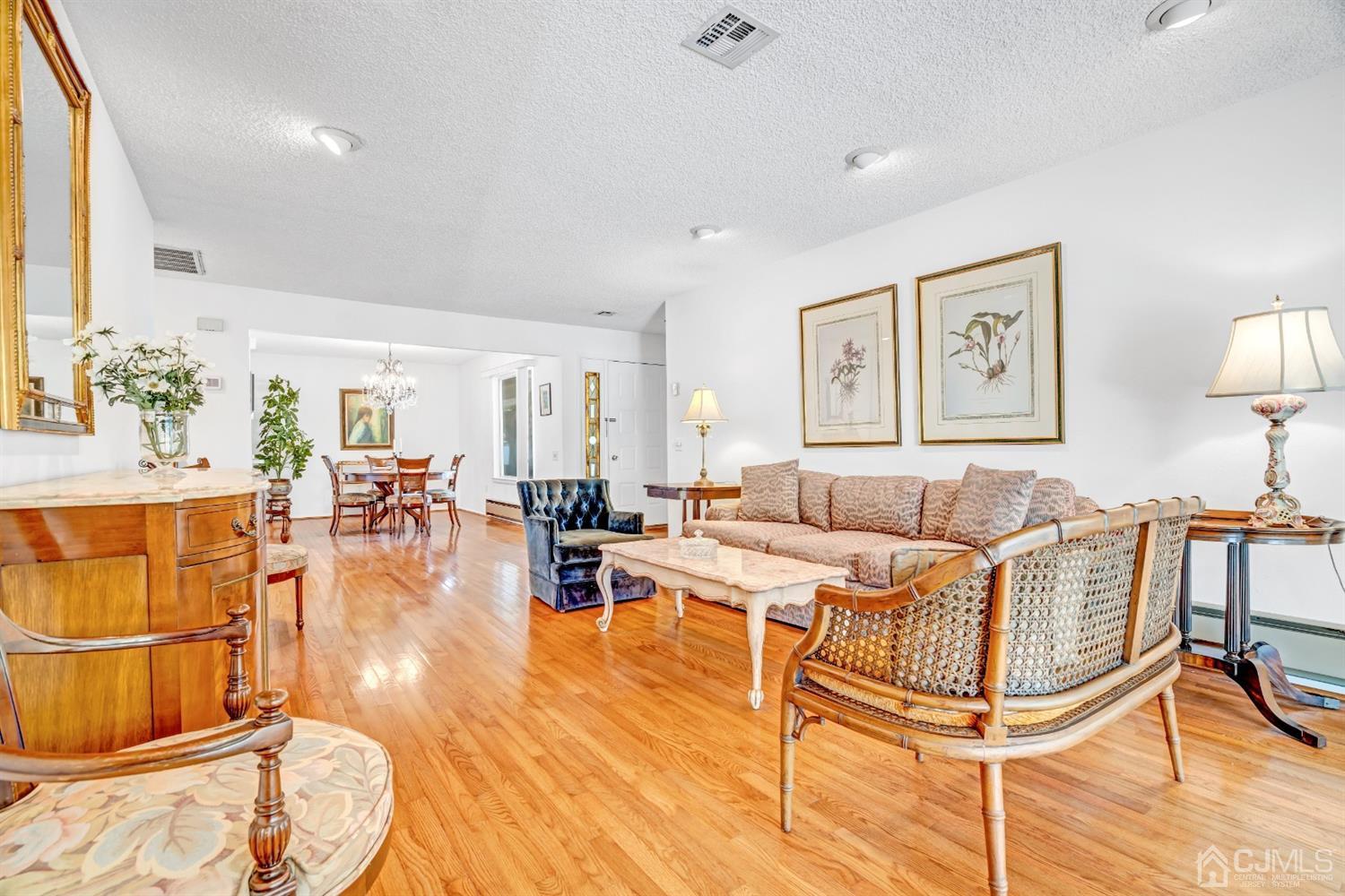 786 Pompton Road, Unit B Monroe Township, NJ 08831 - Photo 10 of 28 a living room with furniture and wooden floor