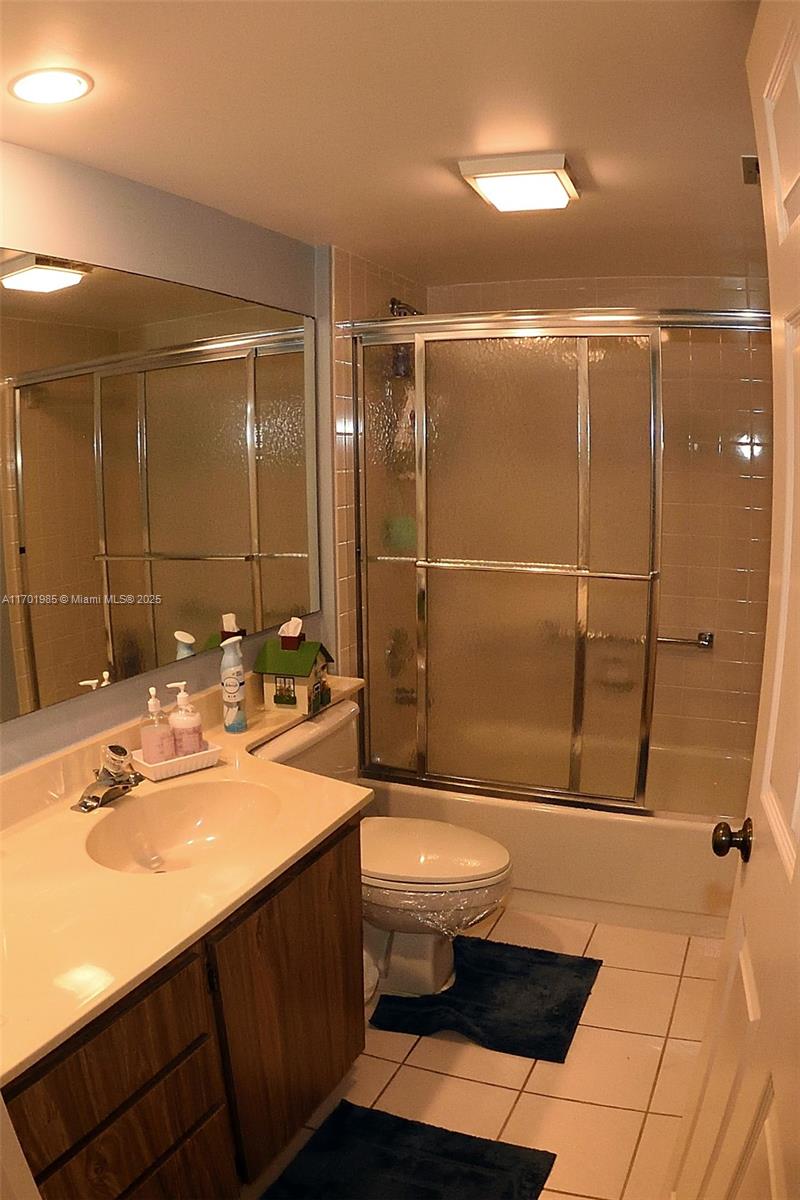 6085 Balboa Circle, Unit 402 Boca Raton, FL 33433 - Photo 14 of 21 a bathroom with a sink toilet and shower