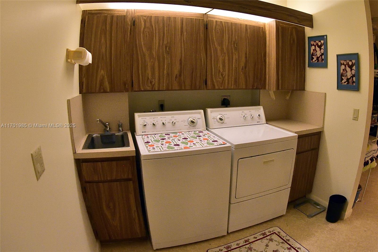 6085 Balboa Circle, Unit 402 Boca Raton, FL 33433 - Photo 16 of 21 a utility room with dryer and washer