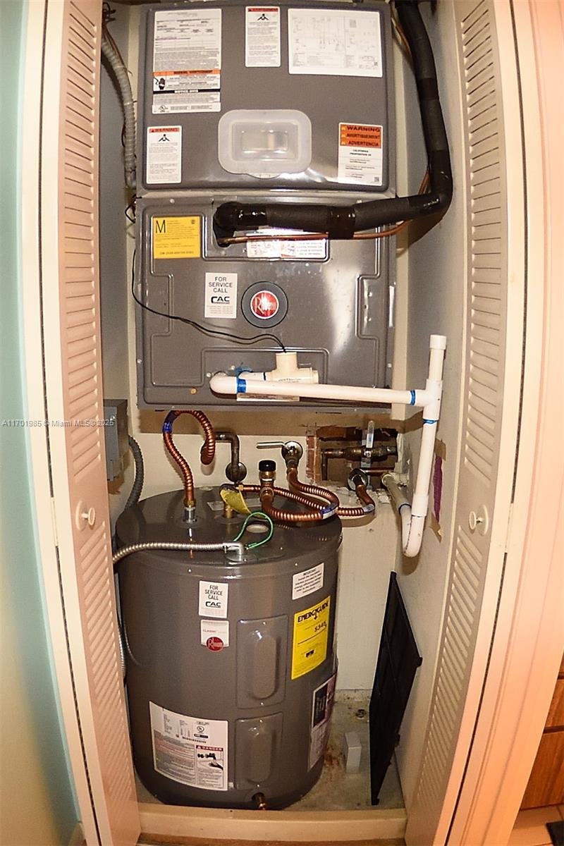 6085 Balboa Circle, Unit 402 Boca Raton, FL 33433 - Photo 17 of 21 a view of water heater on the wall