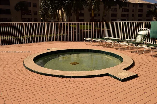 a view of a swimming pool with deck