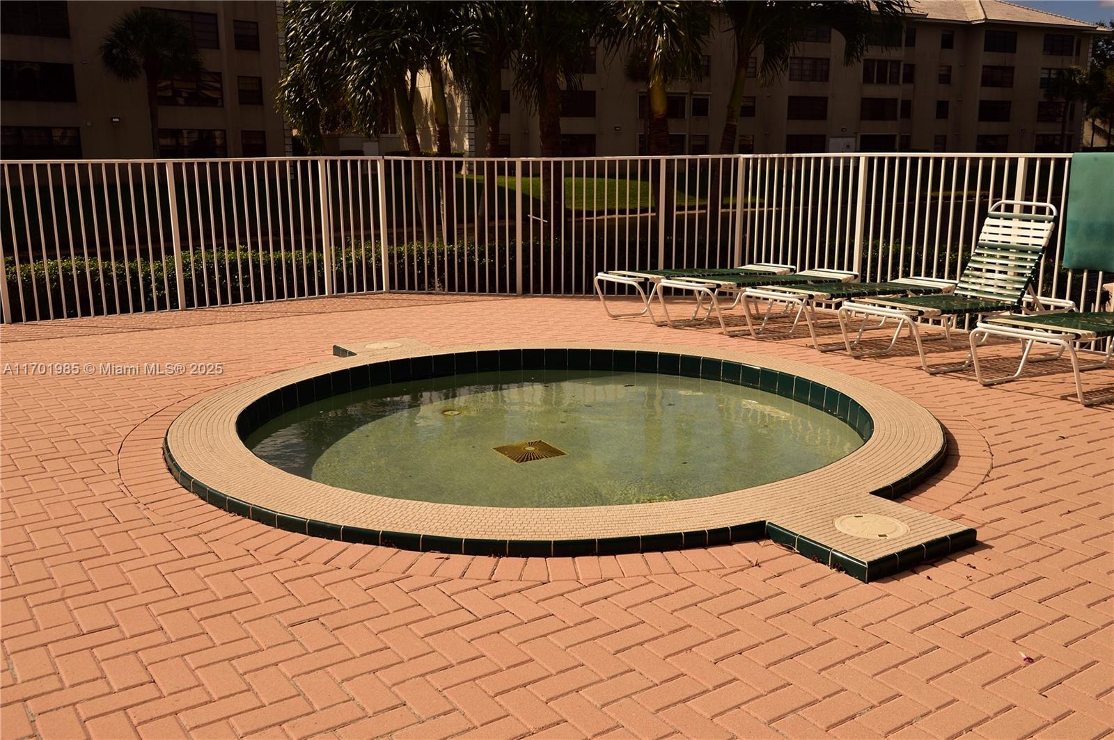 6085 Balboa Circle, Unit 402 Boca Raton, FL 33433 - Photo 19 of 21 a view of a swimming pool with deck