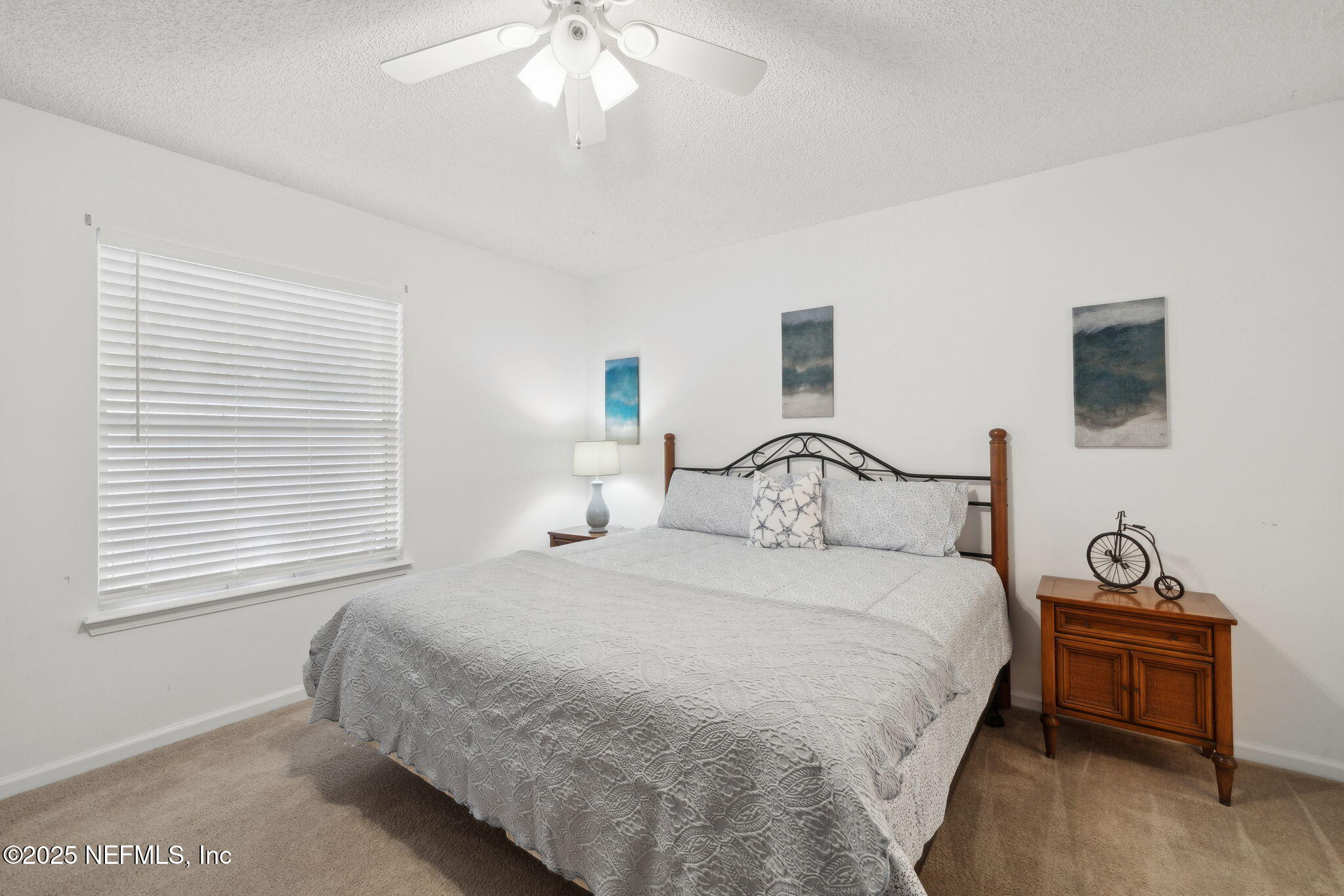 905 Country Bridge Road, Unit 1 St. Johns, FL 32259 - Photo 19 of 43 a bedroom with a bed and a chandelier