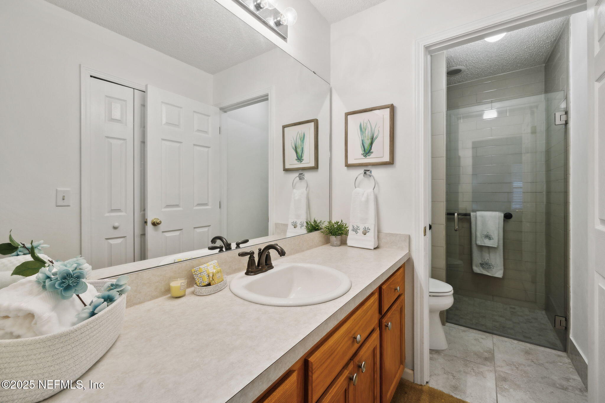 905 Country Bridge Road, Unit 1 St. Johns, FL 32259 - Photo 21 of 43 a bathroom with a granite countertop sink a toilet and shower