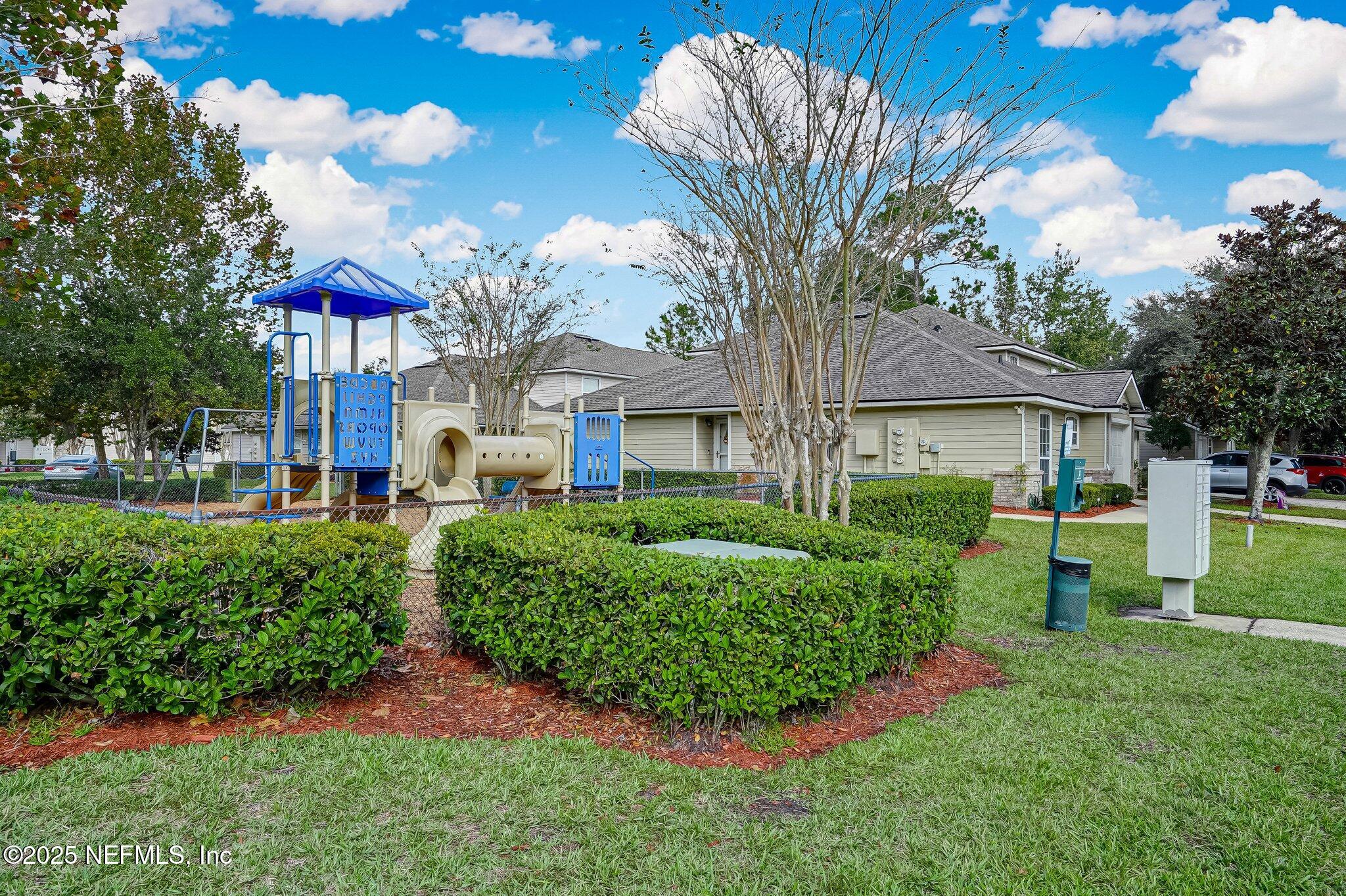 905 Country Bridge Road, Unit 1 St. Johns, FL 32259 - Photo 31 of 43 a front view of a house with a yard and outdoor seating