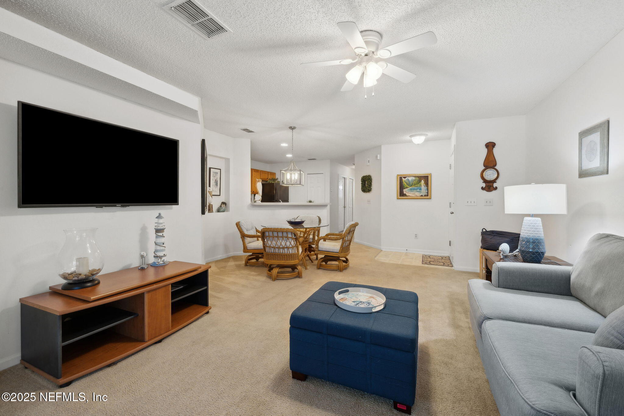 905 Country Bridge Road, Unit 1 St. Johns, FL 32259 - Photo 10 of 43 a living room with furniture and a flat screen tv