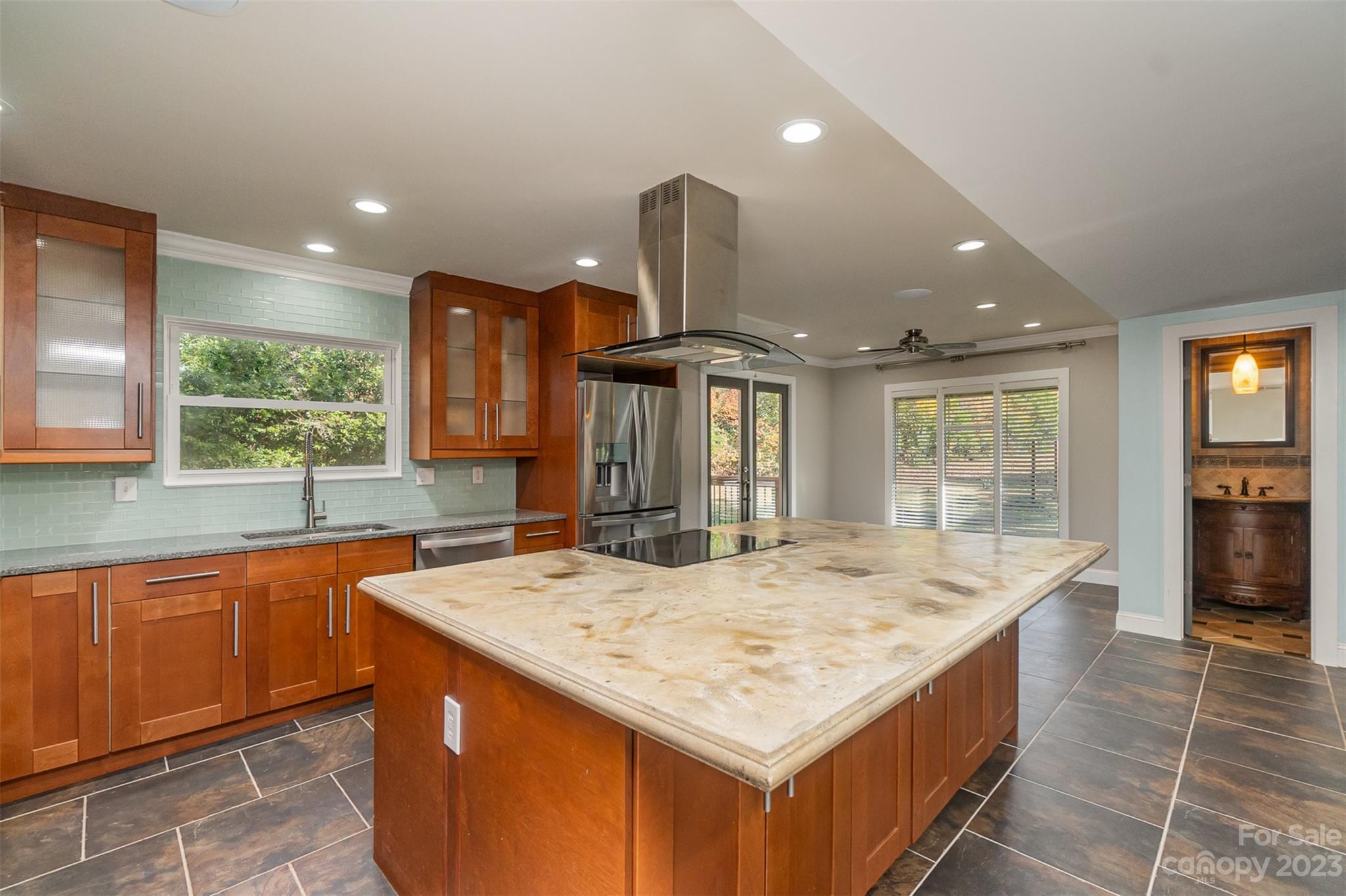 6745 Alanbrook Road Charlotte, NC 28215 - Photo 2 of 28 a kitchen with granite countertop sink and stove