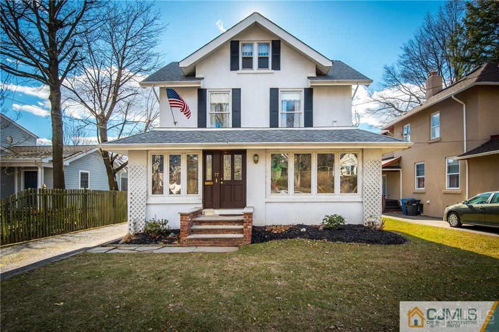 77 Rector Street Metuchen, NJ 08840 - Photo 1 of 24 a front view of a house with a yard