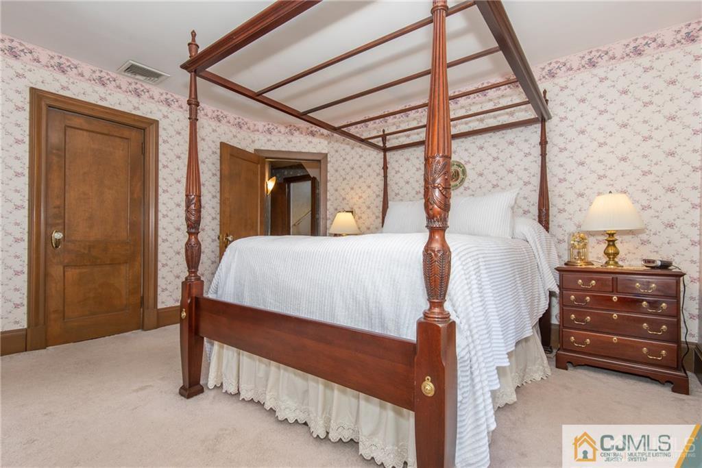77 Rector Street Metuchen, NJ 08840 - Photo 12 of 24 a bed room with a bed and a window
