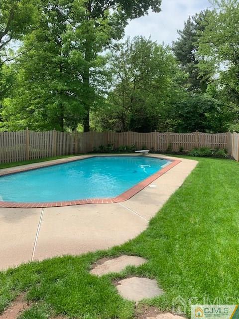 77 Rector Street Metuchen, NJ 08840 - Photo 23 of 24 a view of a backyard with wooden fence